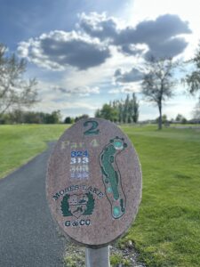 Hole 2 sign showing Par 4 at 324 Yards.